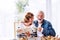 Senior couple eating breakfast at home.