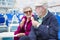 Senior Couple Eating Ice Cream On Deck Of Cruise Ship