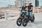 Senior couple, electric bike and ride by the beach for fun bonding activity or travel together in the city. Happy