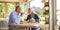 Senior couple enjoying eating burger together at a cafe