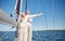 Senior couple enjoying freedom on sail boat in sea