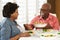 Senior Couple Enjoying Meal At Home