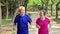 Senior couple exercising outdoors at park