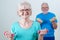 Senior Couple In Fitness Class Using Weights