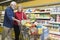 Senior Couple Food Shopping In Supermarket
