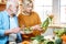 Senior couple with healthy food at home