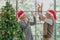 Senior couple high five after decorate Christmas tree together at home