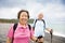 senior couple hiking on the coast beach