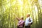Senior Couple hiking in green bamboo