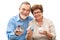 Senior couple holding a house model and piggy bank