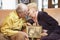 Senior couple holding wedding photo