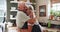 Senior, couple and hug in kitchen with love, support and care in marriage and retirement. Elderly, man and woman embrace