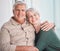 Senior couple, hug and portrait on couch with smile, care and bonding with love, retirement and home living room. Happy