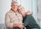 Senior couple, hug and portrait on sofa with smile, care and bonding with love, retirement and home living room. Happy