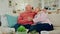 Senior couple, hug and talk on sofa in home living room for memory, thinking and smile for romance. Elderly man, old man