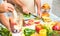 Senior couple in kitchen preparing healthy vegetarian food