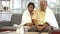 Senior couple looking after each other covering up body with warm towel