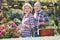 Senior couple looking after flowers in the garden