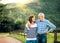 A senior couple in love looking at each other outdoors in nature. Copy space.