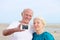 Senior couple making self photo on the beach