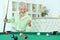 Senior couple playing billiard