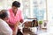 Senior Couple Putting Letter Into Keepsake Box