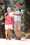 Senior couple reading map on country walk