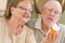 Senior Couple Reading Medicine Bottle