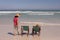 Senior couple relaxing on sun lounger on beach