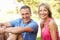 Senior Couple Resting After Exercising In Park