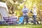 Senior Couple Riding Bikes On Camping Holiday