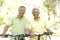 Senior Couple Riding Bikes In Park