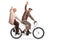 Senior couple riding a tandem bycicle and waving