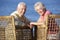 Senior Couple Sitting In Chairs Relaxing On Beach