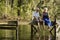 Senior Couple Sitting On Pier At Lake