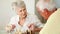 Senior couple sitting at table playing chess