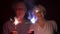 Senior couple with sparklers celebrating. Happy family holding bengal lights enjoying Christmas eve