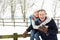 Senior Couple Standing Outside In Snowy Landscape