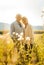 Senior couple on a sunlit meadow embracing each other