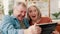 Senior couple, tablet and selfie for social media, app and laughing for joke at home. Happy elderly people, technology