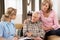 Senior Couple Talking To Health Visitor