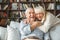 Senior couple together at home retirement concept hugging laughing