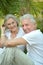 Senior couple at tropic hotel garden