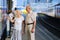 Senior couple waiting for train at railway station