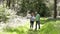 Senior Couple Walking Along Summer Woodland Path Together