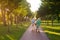 Senior couple walking with bicycle.