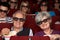 Senior Couple Watching 3D Film In Cinema