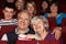 Senior Couple Watching Film In Cinema