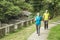 Senior couple wearing face mask and walking trough nature park