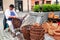 Senior craftsman while weaving wicker basket. Traditional Slovak folk craft